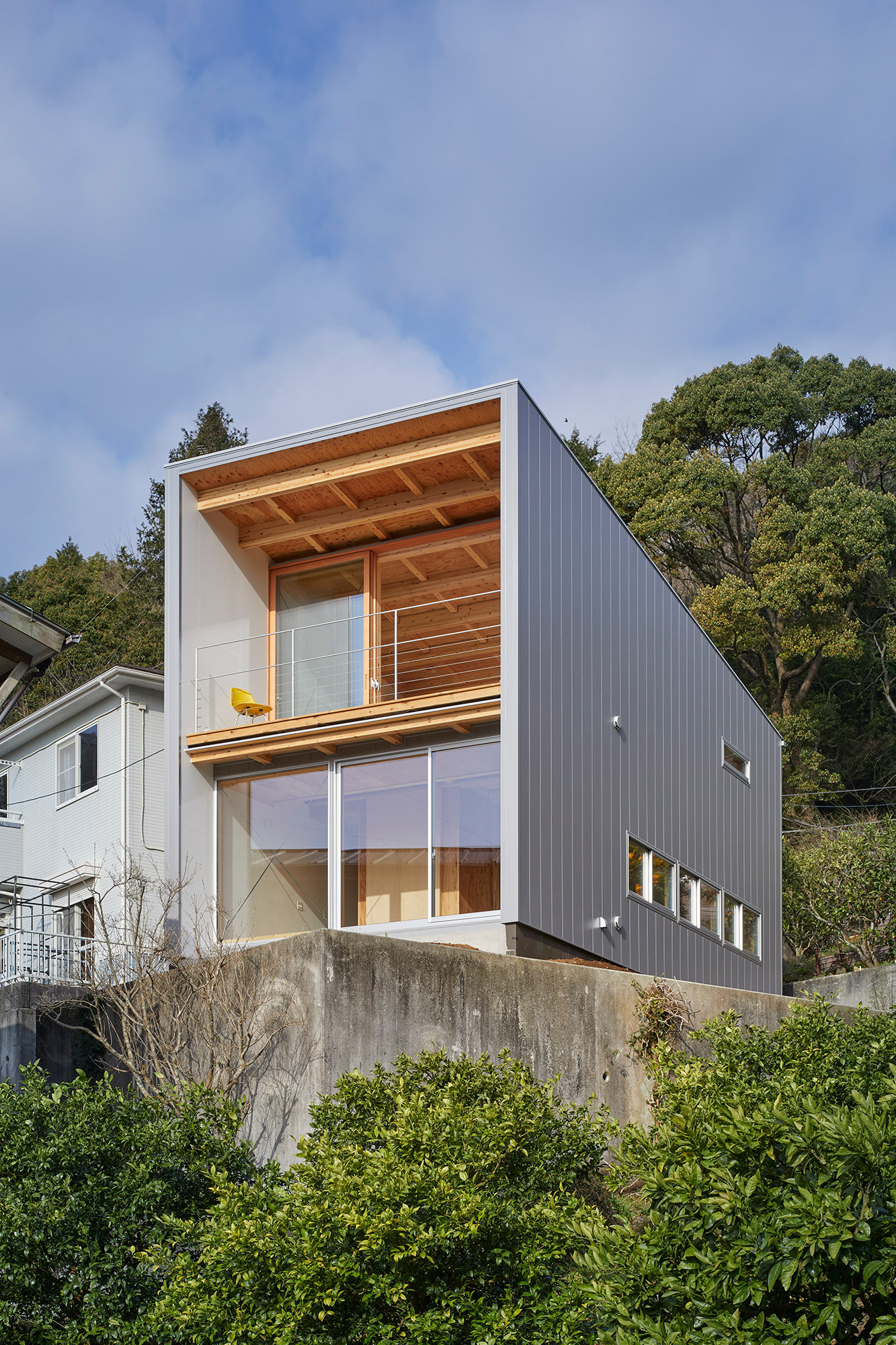 Modern single-sloped roof house built on a mountainside slope