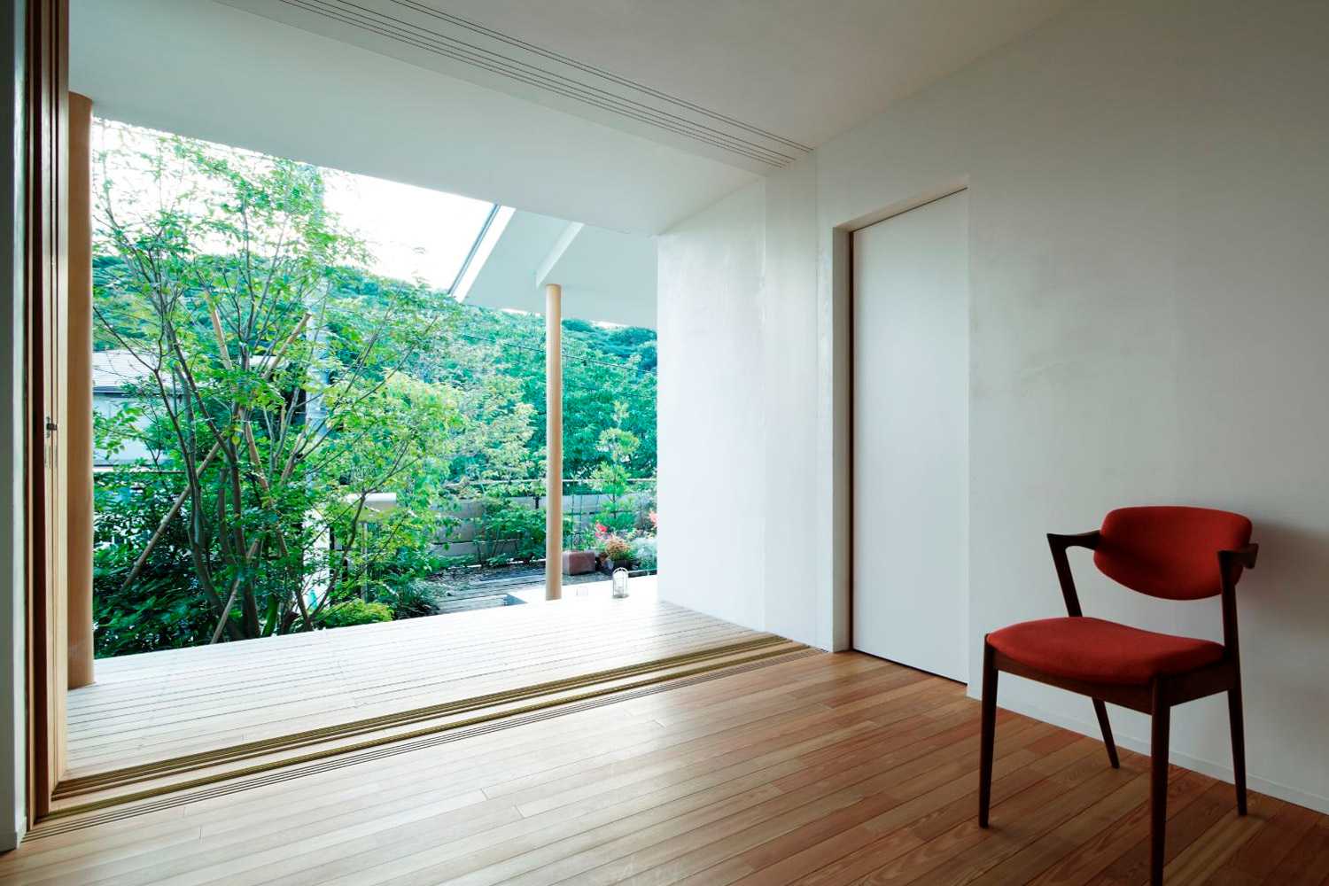 Simple Japanese-Western interior overlooking lush greenery