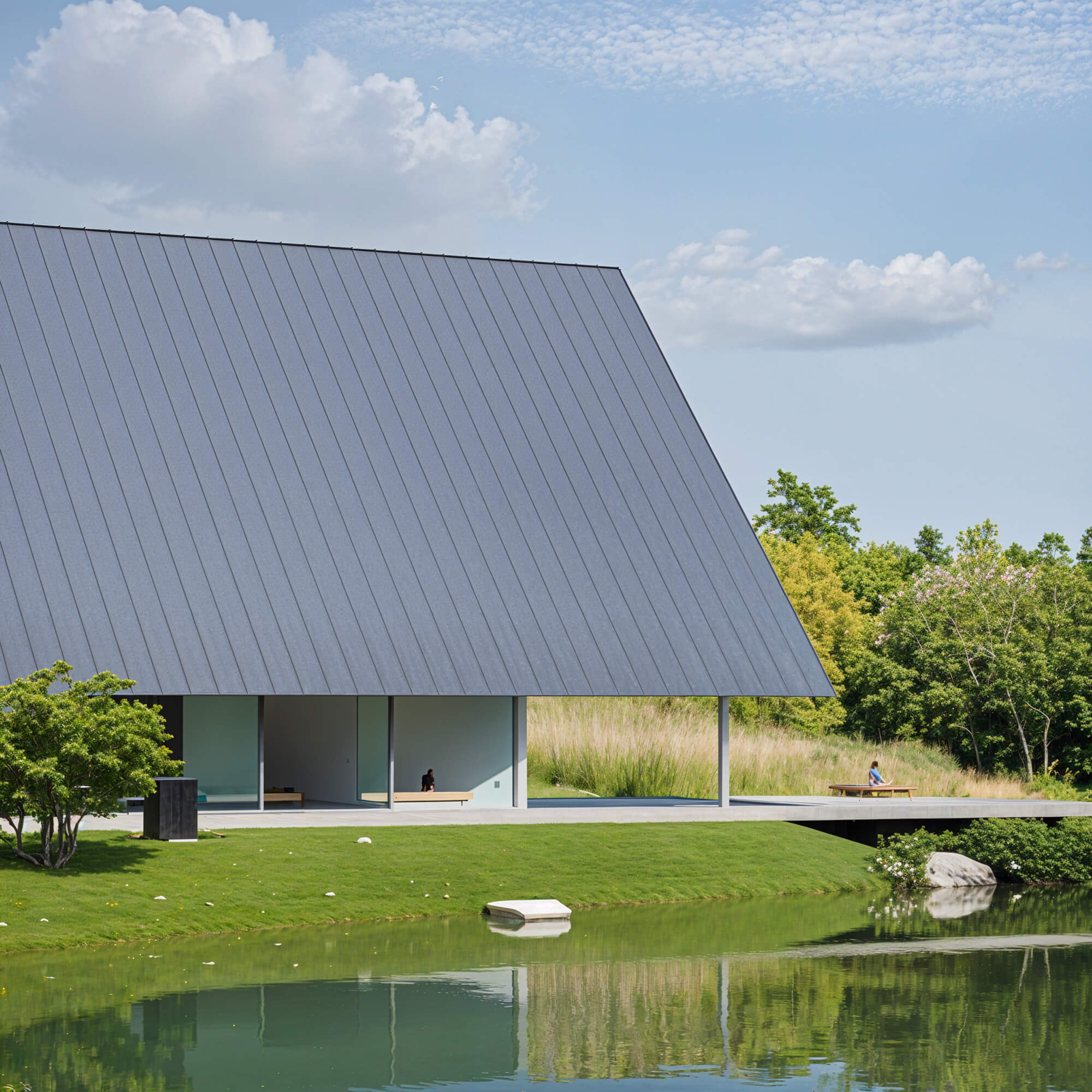 Triangular-roofed house beside a pond