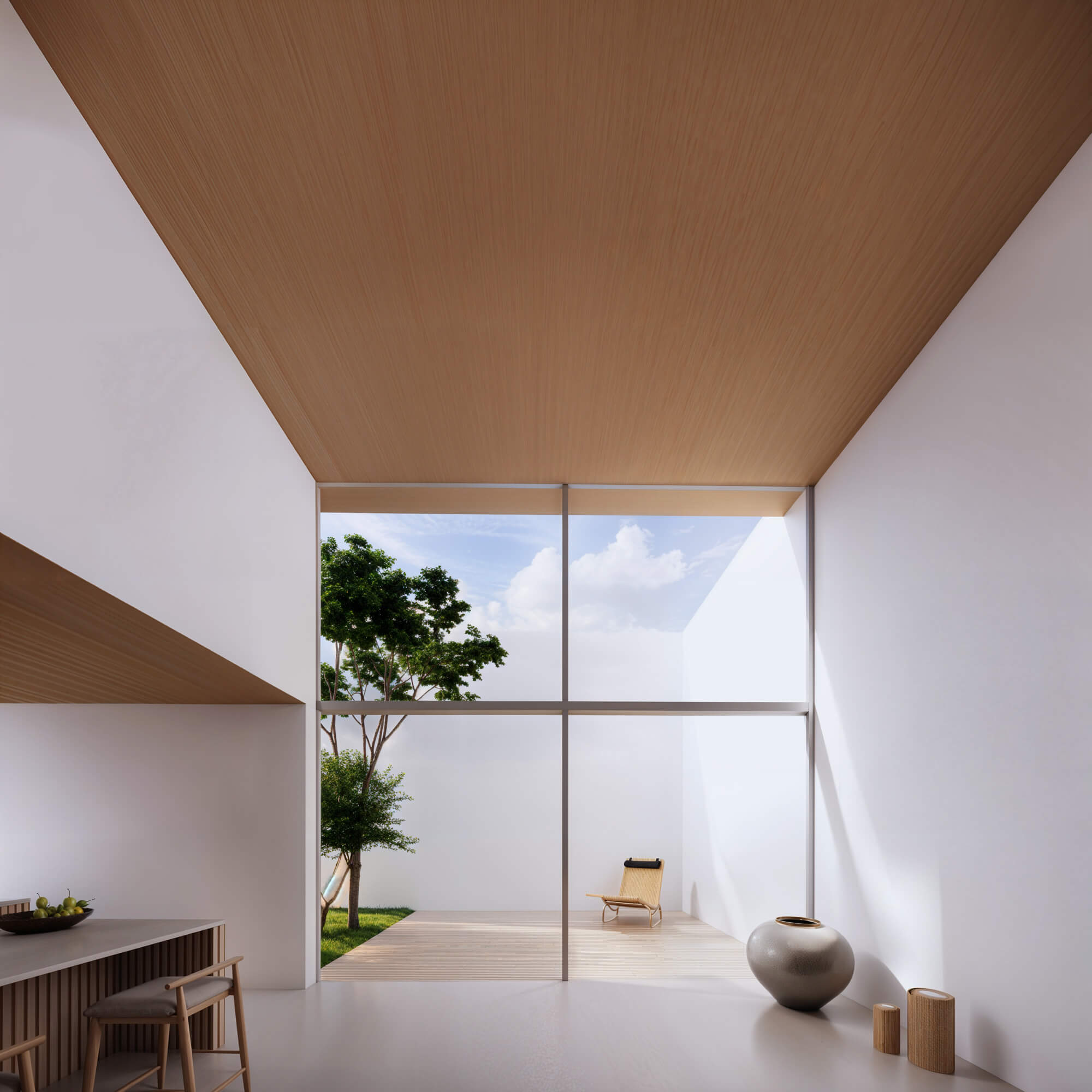 Bright kitchen area with light streaming in through large windows