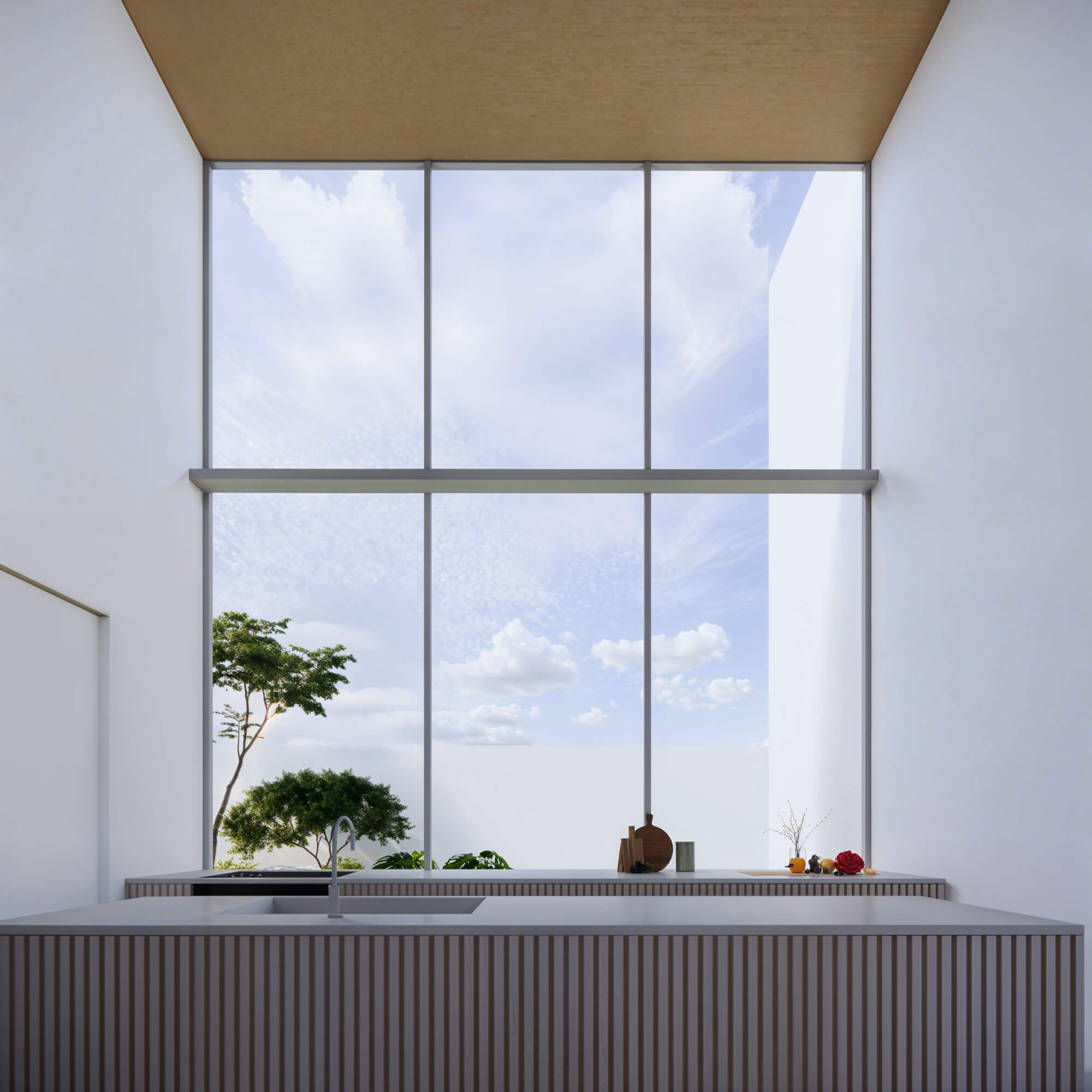 Island kitchen with natural light streaming in through large windows
