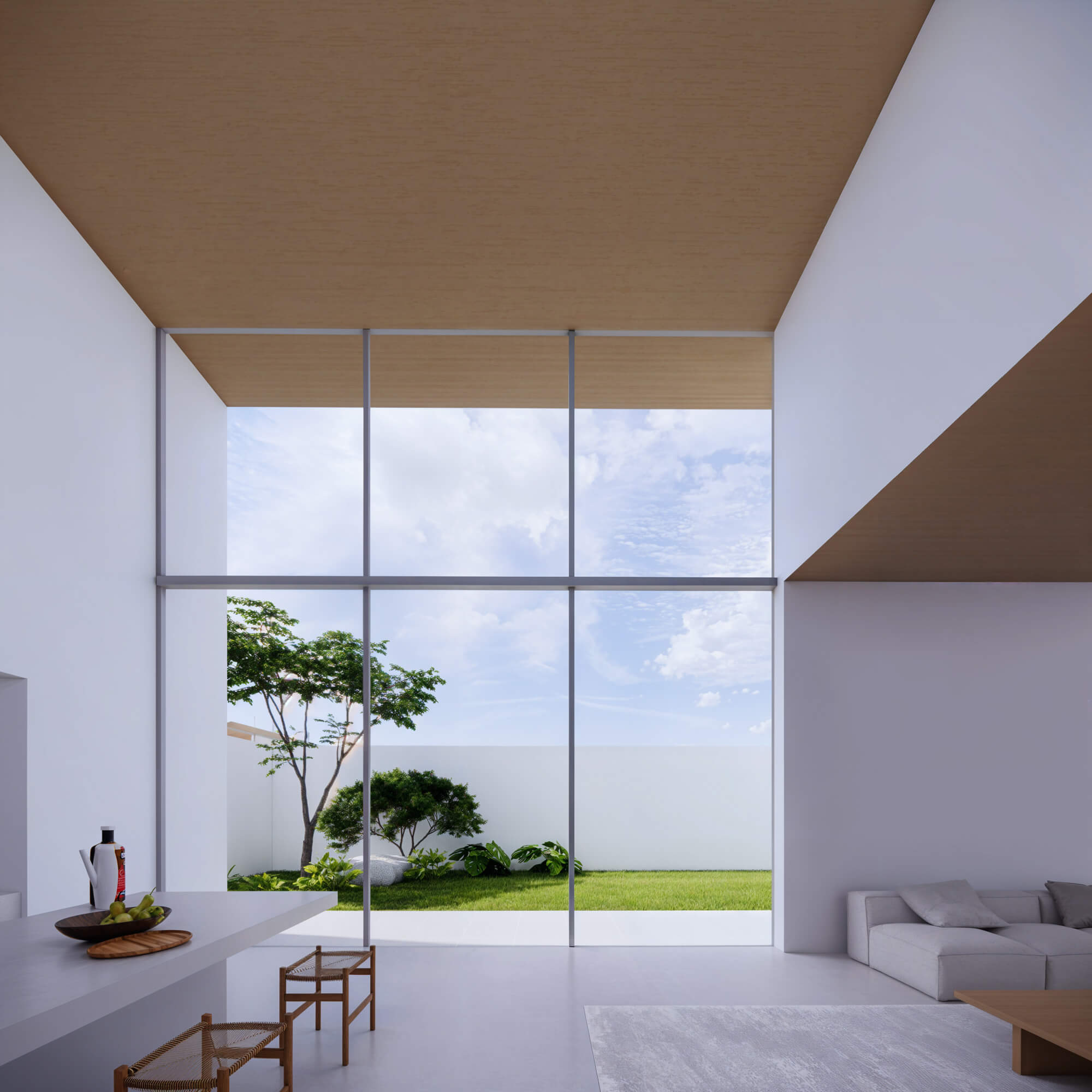 Living and dining space with ocean view through large windows