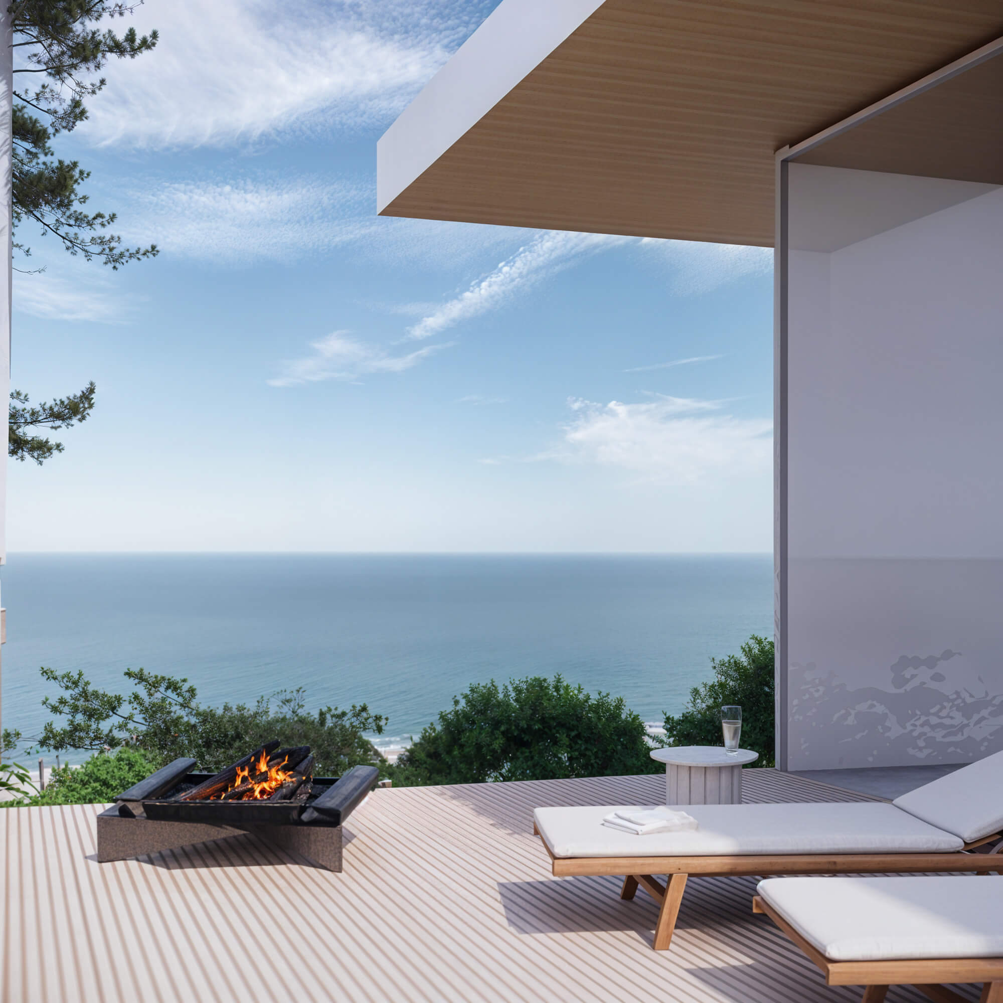 Terrace with wooden deck and outdoor sofa overlooking the sea