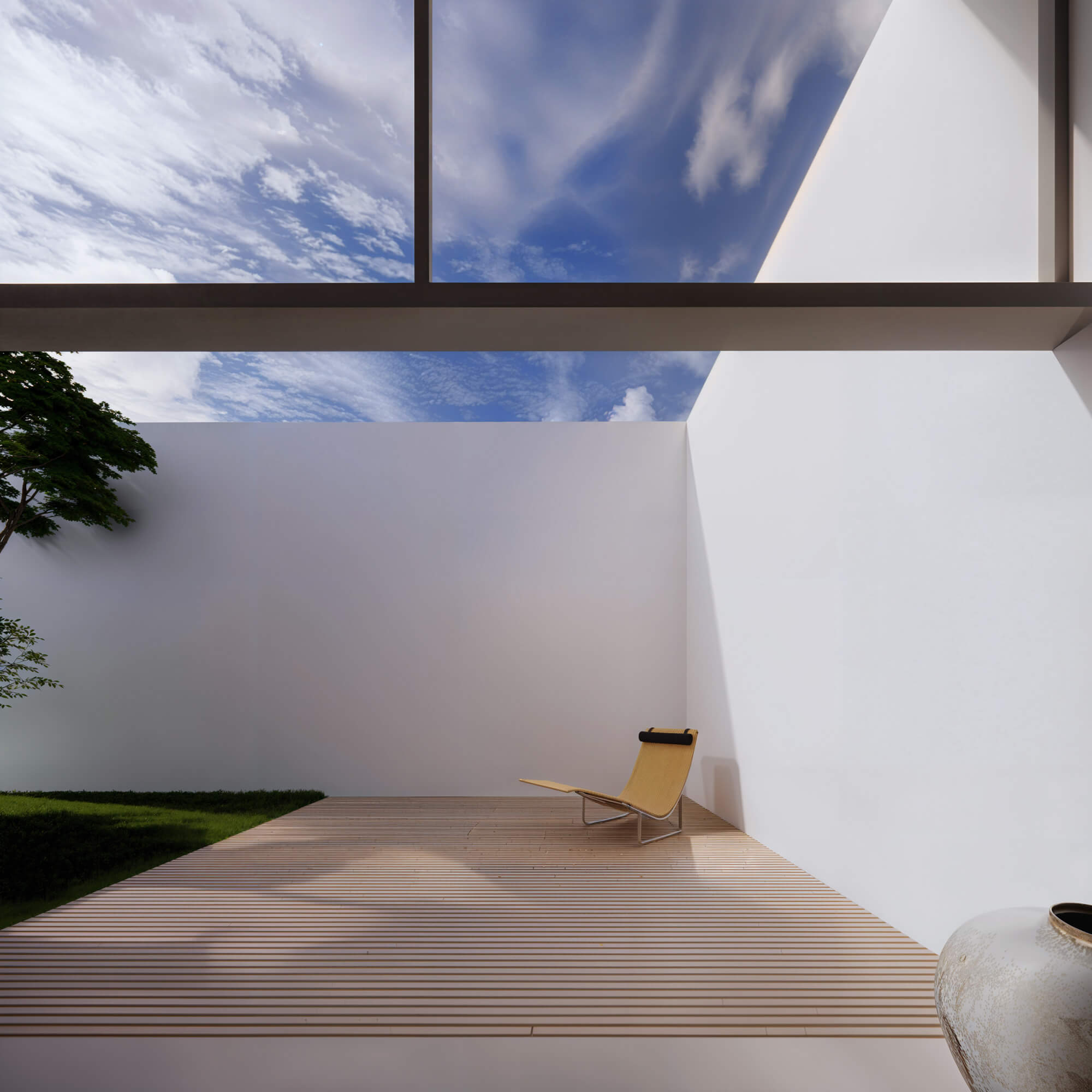 Wood deck surrounded by white walls and a courtyard filled with sunlight