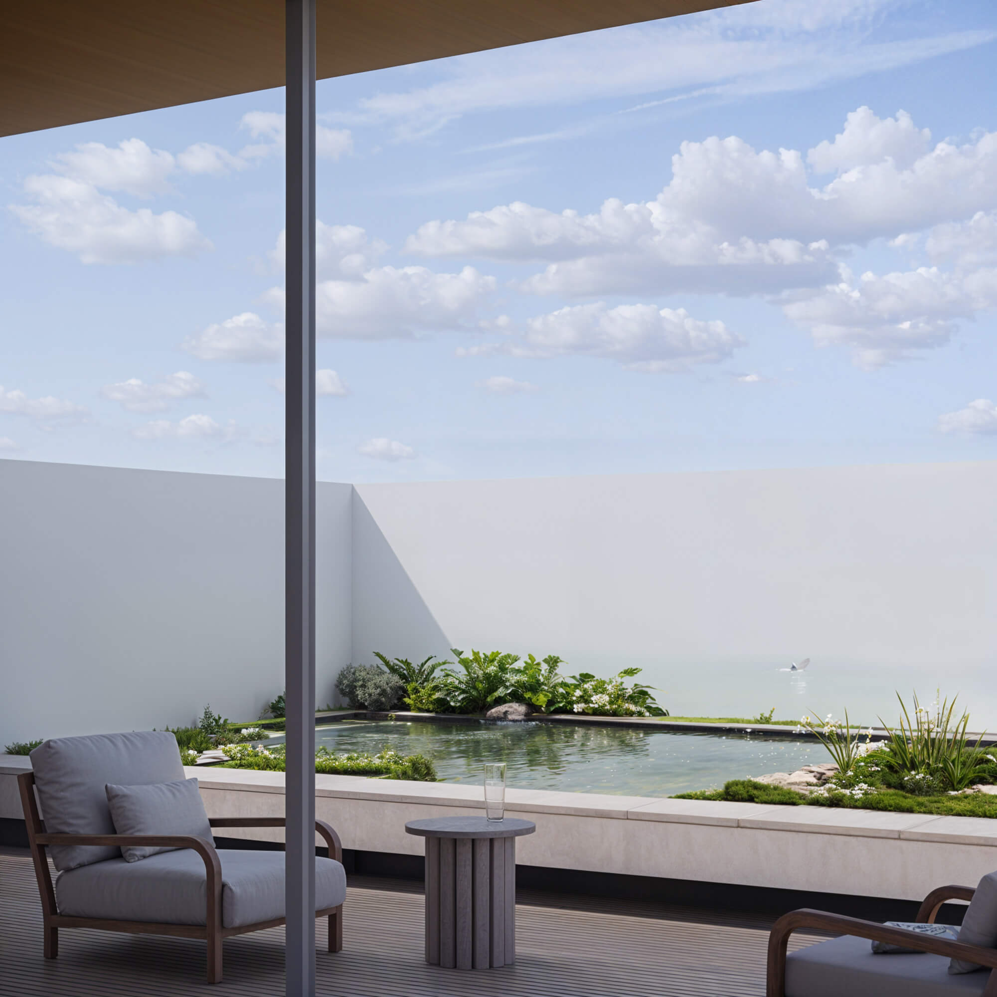 Quiet courtyard with low greenery and concrete flooring