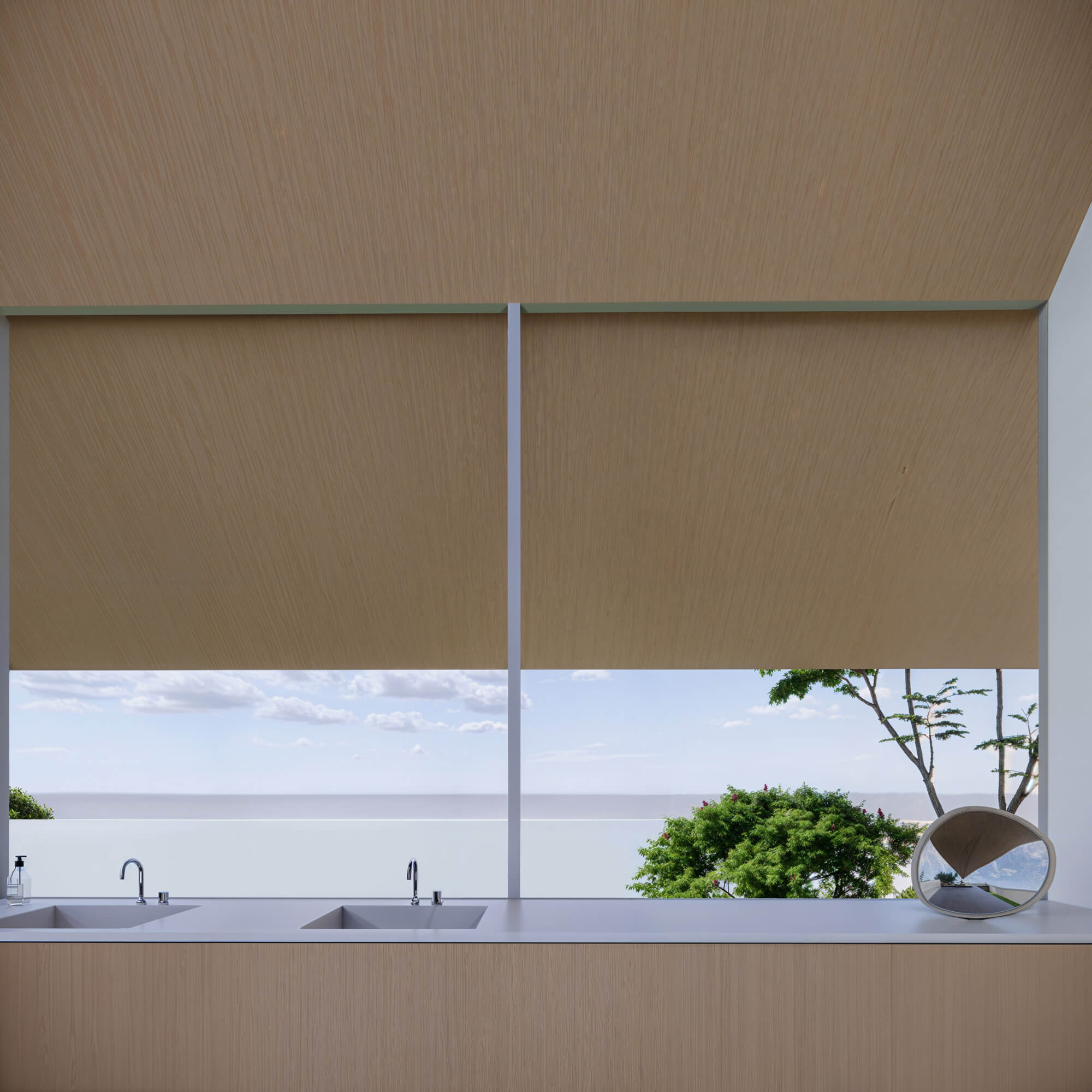 Wash space with bathtubs behind a roll screen
