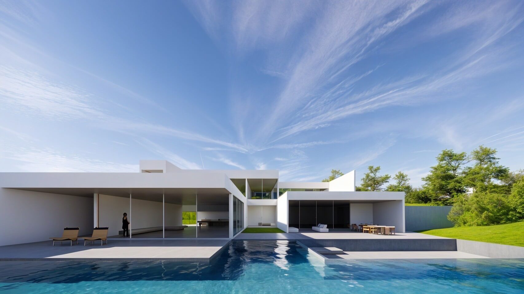 A minimal modern residence with a pool overlooking Lake Toya